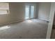 Bedroom features a large window and access to the back patio at 1060 Walt Williams Rd, Lakeland, FL 33809