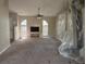 Living room with a ceiling fan and tiled fireplace, offering an open and inviting space at 1060 Walt Williams Rd, Lakeland, FL 33809