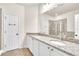 Bathroom featuring double sinks, granite countertops, and a glass-enclosed shower at 11754 Barletta Dr, Orlando, FL 32827