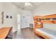 Bedroom featuring wood floors, ceiling fan, a bunk bed, and closet at 11754 Barletta Dr, Orlando, FL 32827