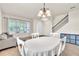 Bright and airy dining area with tiled floors, a round table, and seamless access to living spaces at 11754 Barletta Dr, Orlando, FL 32827