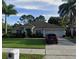 Charming single story home with a well manicured lawn, mature landscaping, and a two car garage at 1201 Thornbury Ct, Winter Garden, FL 34787