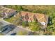 Aerial view of townhouses showing layout, landscaping, and parking at 1290 Grady Ln # 20232, Davenport, FL 33896