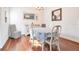 Well-lit dining room featuring hardwood floors, a large mirror, and a dining table with seating at 1290 Grady Ln # 20232, Davenport, FL 33896