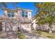 Townhouse exterior with two-car garage and manicured landscaping in a sunny neighborhood at 1290 Grady Ln # 20232, Davenport, FL 33896