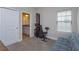 Bedroom space with an exercise machine with a view of an ensuite bathroom at 1304 Spotted Sandpiper Loop, Winter Springs, FL 32708