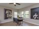 Cozy dining area with natural light and unique wall art at 1304 Spotted Sandpiper Loop, Winter Springs, FL 32708