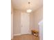 Cozy entryway with tile floors, a shoe rack, and a modern light fixture at 1304 Spotted Sandpiper Loop, Winter Springs, FL 32708