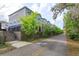 Exterior view of the building on a street with trees and a sidewalk at 1304 Spotted Sandpiper Loop, Winter Springs, FL 32708