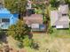 Aerial view showcasing the home's layout, pool, and landscaping, with beautiful trees at 1312 Golfside Dr, Winter Park, FL 32792