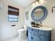 Charming bathroom features a vanity with a decorative mirror at 1312 Golfside Dr, Winter Park, FL 32792