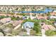 An aerial shot showcasing the beautiful neighborhood, the home's pool and landscaping at 1403 Lake Whitney Dr, Windermere, FL 34786