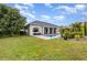 Inviting backyard pool with lush landscaping and ample patio space for relaxation and entertaining at 1403 Lake Whitney Dr, Windermere, FL 34786