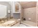 Bathroom with a single vanity and a shower over tub combination, featuring a mirrored medicine cabinet at 1403 Lake Whitney Dr, Windermere, FL 34786