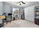 Neutral bedroom featuring a murphy bed, musical instruments, and natural light from the window at 1403 Lake Whitney Dr, Windermere, FL 34786