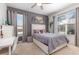 Bedroom featuring windows, curtains, desk, and neutral colors at 1403 Lake Whitney Dr, Windermere, FL 34786