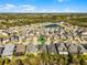 Aerial view of the property's location within a quiet neighborhood, backing to a scenic pond at 14090 Alafaya Oak Bnd, Orlando, FL 32828