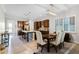 Inviting dining area with a modern light fixture, comfortable seating, and easy access to the kitchen at 14090 Alafaya Oak Bnd, Orlando, FL 32828