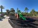 Colorful community playground with slide, climbing wall, and safe surfacing, ideal for Gathering fun at 14090 Alafaya Oak Bnd, Orlando, FL 32828