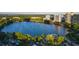 Exterior aerial shot of a lake with lush trees and multiple city buildings at 150 E Robinson St # 405, Orlando, FL 32801