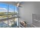 Open living room with winding stairs and natural light at 150 E Robinson St # 405, Orlando, FL 32801