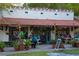 Charming restaurant exterior with outdoor seating, string lights, and lush potted plants enhancing the ambiance at 150 E Robinson St # 405, Orlando, FL 32801