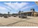 Spacious rooftop terrace with tables, chairs, and stunning city views at 150 E Robinson St # 405, Orlando, FL 32801