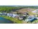 Luxury homes with pools line the waterfront in this beautiful aerial view of the community at 16728 Bolsena Dr, Bella Collina, FL 34756