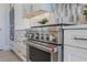 Gourmet kitchen featuring stainless steel appliances and custom cabinetry at 16728 Bolsena Dr, Bella Collina, FL 34756