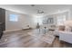 Bright living room with a white sectional sofa, decorative pillows and a ceiling fan at 16728 Bolsena Dr, Bella Collina, FL 34756