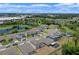 Aerial view showcasing the layout of the neighborhood with its beautiful landscaping and multiple ponds at 17319 Million Lakes Ct, Clermont, FL 34714