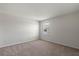 Cozy bedroom with a neutral color palette and carpeted flooring at 17319 Million Lakes Ct, Clermont, FL 34714