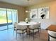 Dining area with elegant table setting and natural light at 17319 Million Lakes Ct, Clermont, FL 34714