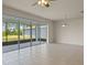 Bright living room with sliding glass doors leading to the backyard at 17319 Million Lakes Ct, Clermont, FL 34714