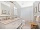 Elegant bathroom featuring double sinks, marble countertops, and decorative tile flooring at 1840 W Fawsett Rd, Winter Park, FL 32789