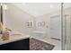 Elegant bathroom featuring a standalone tub, glass enclosed shower, and marble vanity at 1840 W Fawsett Rd, Winter Park, FL 32789