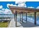 Covered boat dock with lift, and seating area, ideal for boating and enjoying the lake at 1840 W Fawsett Rd, Winter Park, FL 32789