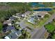 Aerial view of the neighborhood featuring well-maintained homes, landscaping, and a nearby pond at 1924 Stonecrest Ct, Orlando, FL 32825