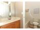 Bright bathroom with a wood vanity and a shower-tub combo at 1924 Stonecrest Ct, Orlando, FL 32825