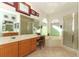 Spacious bathroom featuring a double vanity, bathtub, walk-in shower and tile flooring at 1924 Stonecrest Ct, Orlando, FL 32825