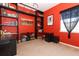 Bedroom featuring built-in shelving, a work desk, and natural light from a window at 1924 Stonecrest Ct, Orlando, FL 32825