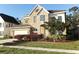 Charming two-story home featuring manicured landscaping and a well-maintained lawn at 1924 Stonecrest Ct, Orlando, FL 32825