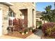 Charming home exterior showcasing a well-manicured front yard with lush landscaping and stone accents at 1924 Stonecrest Ct, Orlando, FL 32825