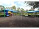 Community playground area featuring a slide, swings, and shaded seating for Gathering enjoyment at 1924 Stonecrest Ct, Orlando, FL 32825