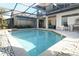 Beautiful in-ground pool featuring brick patio, screened enclosure, and a sunny location at 1924 Stonecrest Ct, Orlando, FL 32825