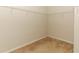 Empty walk-in closet with carpet floors and metal shelving at 1924 Stonecrest Ct, Orlando, FL 32825