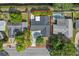 Aerial view outlining a house with a dark roof, lush greenery, and a fenced pool at 230 S Ranger Blvd, Winter Park, FL 32792