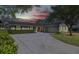 Ranch-style home boasts a red front door and long driveway at 230 S Ranger Blvd, Winter Park, FL 32792