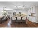 An island kitchen is accentuated by pendant lighting and is adjacent to a dining area at 230 S Ranger Blvd, Winter Park, FL 32792