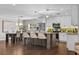 A kitchen area features stainless steel appliances, pendant lighting, and a granite island at 230 S Ranger Blvd, Winter Park, FL 32792